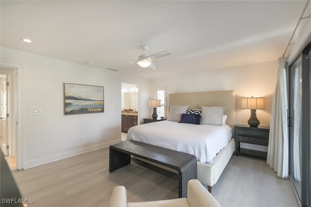 bedroom with ceiling fan, light wood-type flooring, and ensuite bathroom