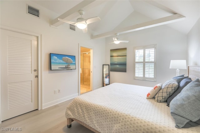 bedroom with ceiling fan, lofted ceiling, connected bathroom, and light hardwood / wood-style flooring