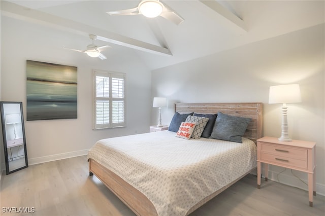 bedroom with vaulted ceiling with beams, ceiling fan, and light hardwood / wood-style floors