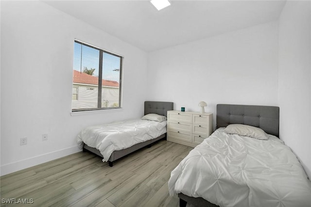 bedroom featuring light wood-type flooring