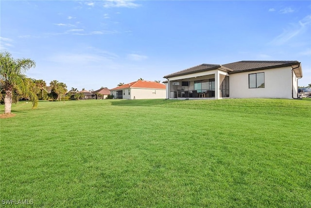 view of yard with a sunroom