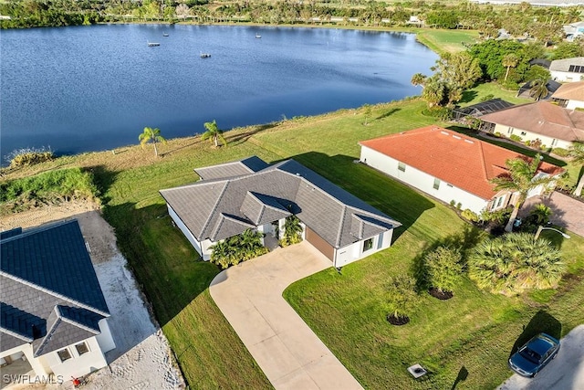 drone / aerial view with a water view