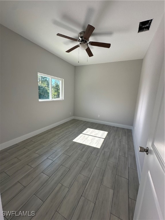 unfurnished room featuring hardwood / wood-style flooring and ceiling fan