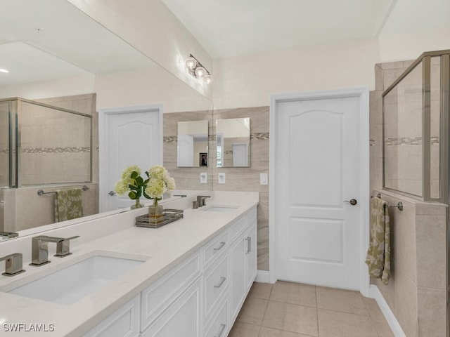 bathroom with vanity, tile patterned floors, and a shower with shower door