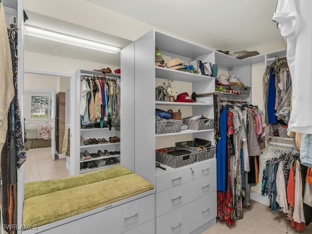 spacious closet with light tile patterned flooring