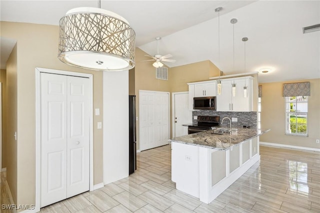 kitchen featuring white cabinetry, ceiling fan, hanging light fixtures, kitchen peninsula, and appliances with stainless steel finishes