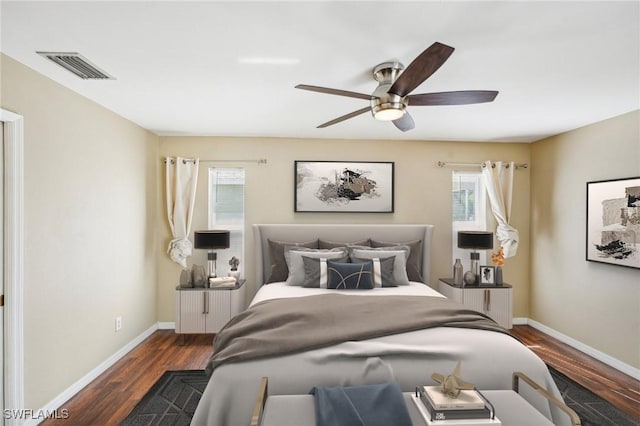 bedroom featuring ceiling fan and dark wood-type flooring