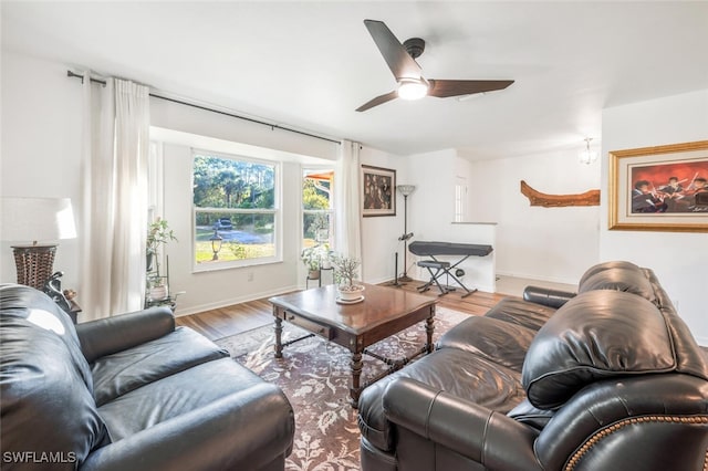 living room featuring ceiling fan and wood-type flooring