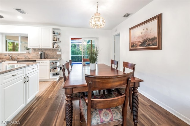 3671 8th Ave SE, Naples, FL 34117 - dining room with wood finished floors, plenty of natural light, a chandelier, and recessed lighting