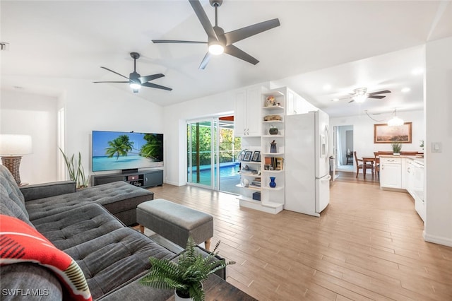 living room with light hardwood / wood-style flooring, ceiling fan, and lofted ceiling