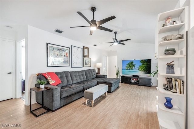 living room featuring ceiling fan and light wood-type flooring