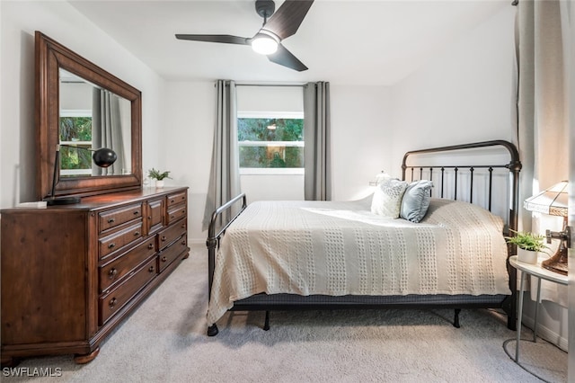 3671 8th Ave SE, Naples, FL 34117 - bedroom with light colored carpet and a ceiling fan