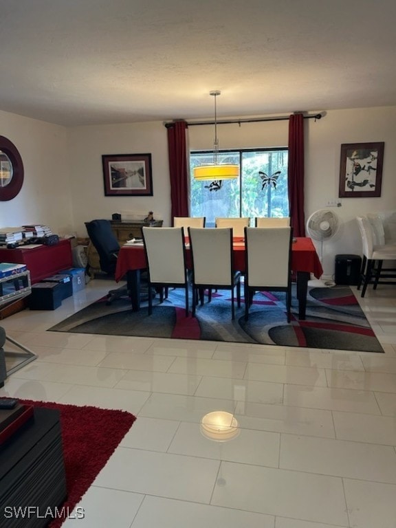 dining space with tile patterned floors