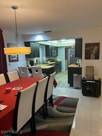 dining room featuring light tile patterned floors