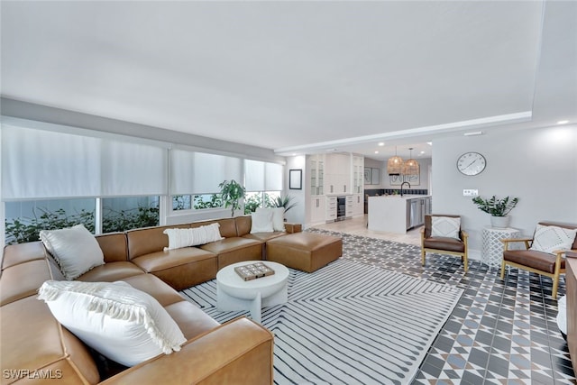 living room featuring sink and beverage cooler