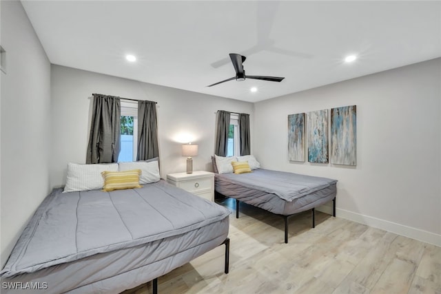 bedroom featuring ceiling fan and light wood-type flooring