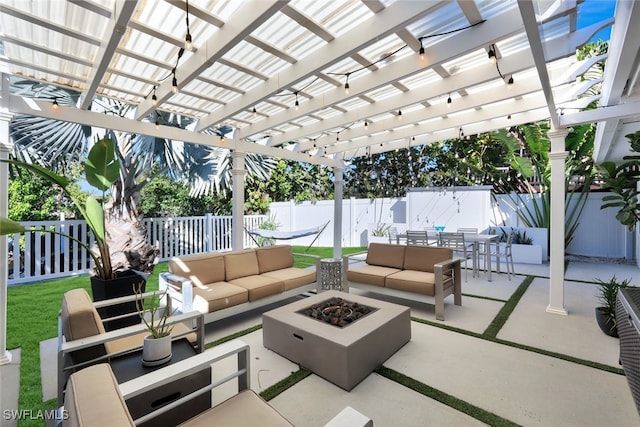 view of patio with a pergola and an outdoor living space with a fire pit