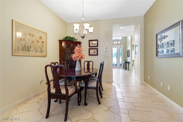 dining space featuring a notable chandelier