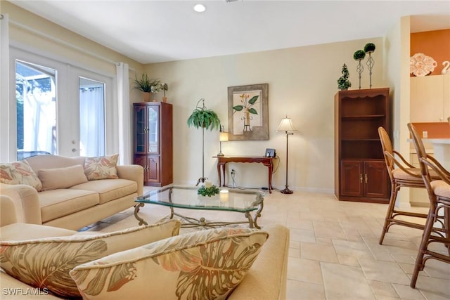 living room with french doors and light tile patterned flooring