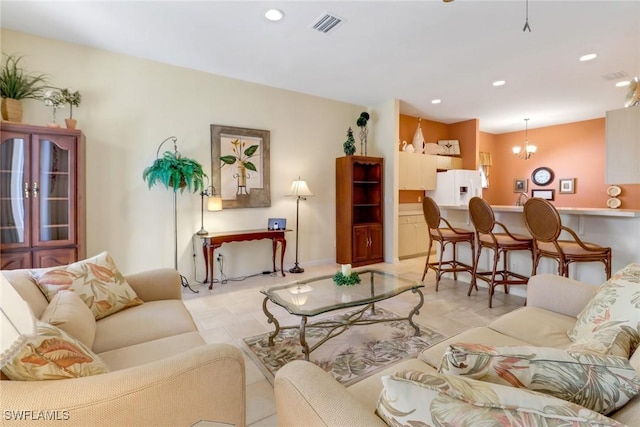 living room featuring an inviting chandelier