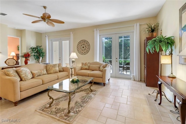 living room with ceiling fan and french doors