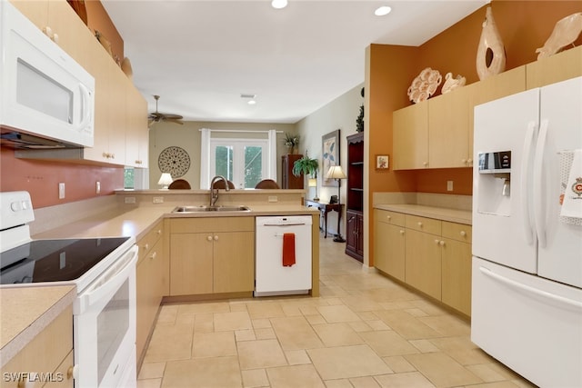 kitchen with light brown cabinets, white appliances, sink, ceiling fan, and kitchen peninsula