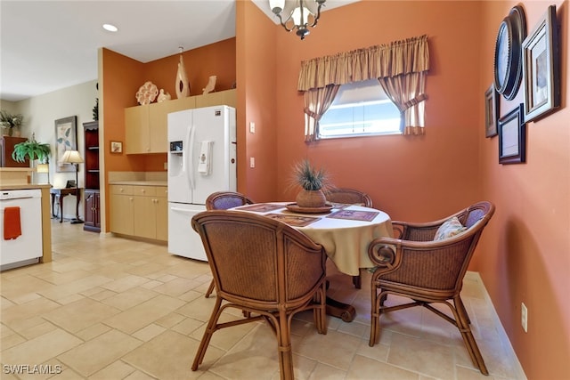 dining space featuring a notable chandelier