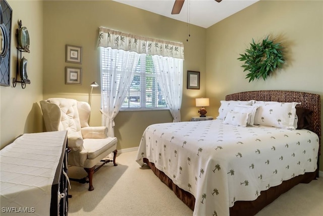 bedroom with ceiling fan and carpet floors