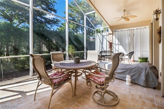 sunroom featuring plenty of natural light and ceiling fan