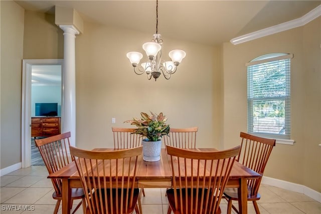 tiled dining area featuring a notable chandelier, lofted ceiling, and decorative columns