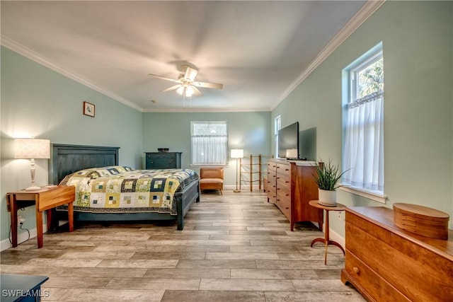 bedroom featuring light hardwood / wood-style floors, ceiling fan, and ornamental molding