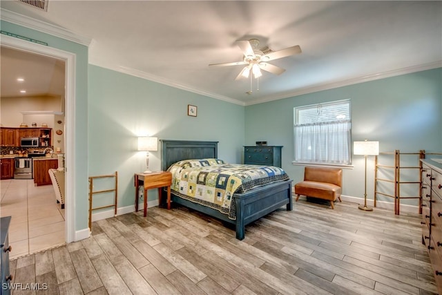 bedroom with light hardwood / wood-style floors, ceiling fan, and ornamental molding