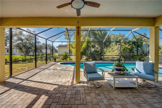 view of patio with a lanai and ceiling fan