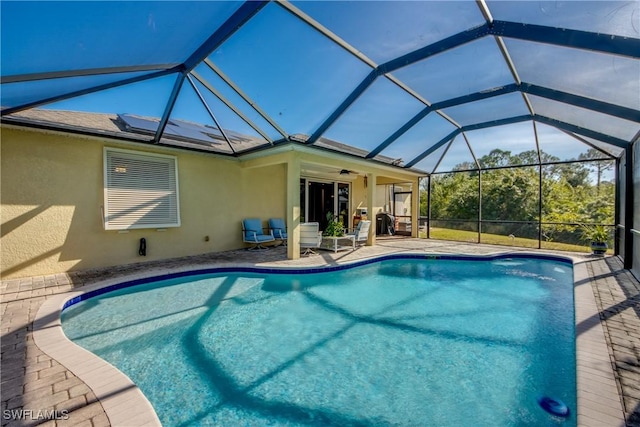 view of pool featuring a patio area and ceiling fan