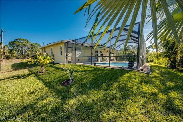 view of yard featuring glass enclosure