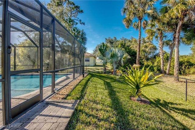 view of yard with a lanai