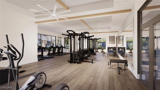 workout area featuring ceiling fan, light wood-type flooring, and a wealth of natural light