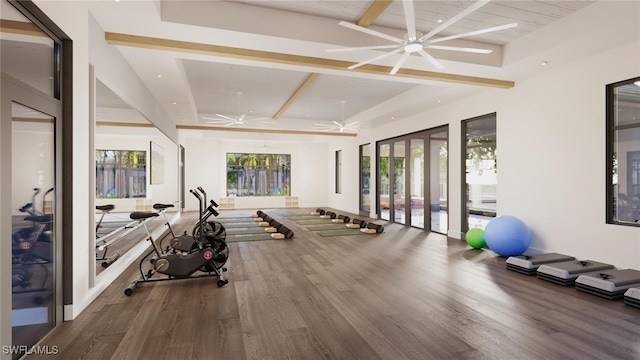 workout area with ceiling fan with notable chandelier, wood-type flooring, and wooden ceiling