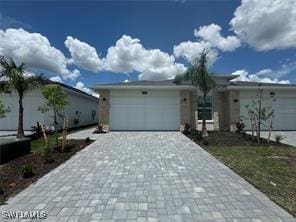 single story home featuring a garage