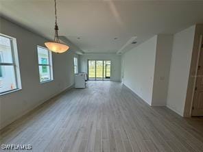 unfurnished living room featuring wood-type flooring