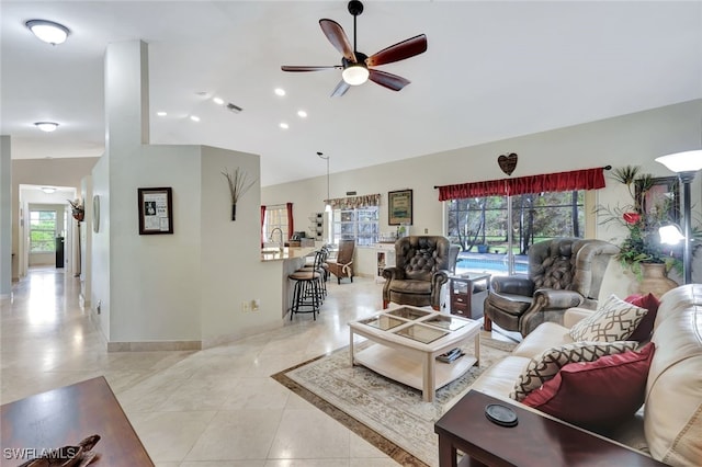 living room with ceiling fan and light tile patterned floors