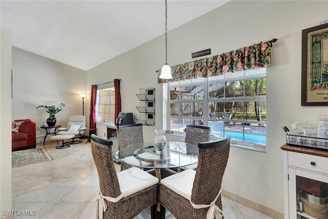 dining area featuring light tile patterned flooring