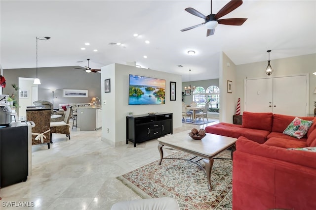 living room with an inviting chandelier and lofted ceiling