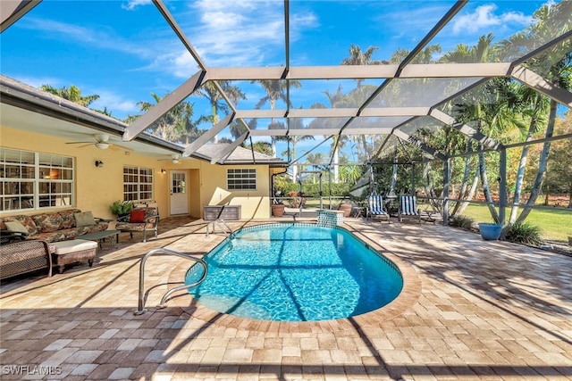 view of pool with a patio, an outdoor hangout area, ceiling fan, and a lanai