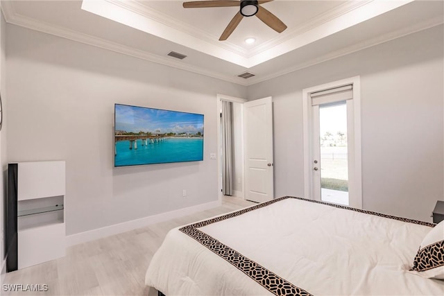 bedroom featuring access to exterior, ornamental molding, a raised ceiling, ceiling fan, and light hardwood / wood-style flooring