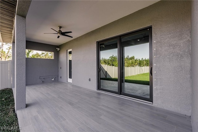 view of patio / terrace with ceiling fan and a wooden deck