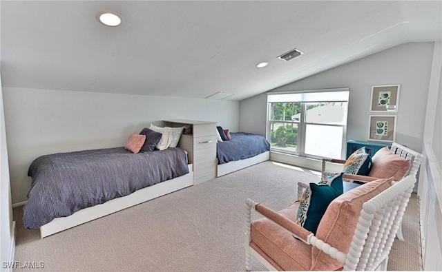 carpeted bedroom featuring lofted ceiling