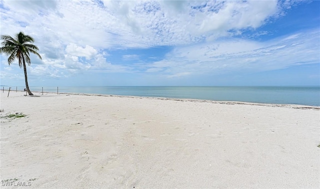 property view of water featuring a beach view