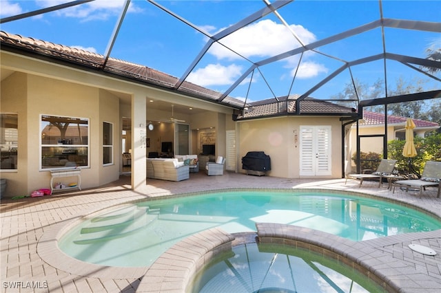 view of pool featuring outdoor lounge area, a lanai, and a patio