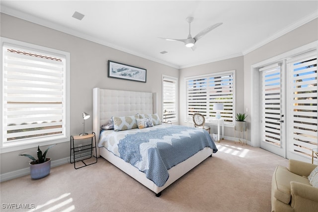 bedroom with ceiling fan, crown molding, and light colored carpet